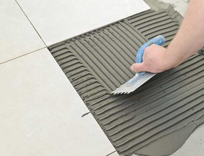 Tile fixing adhesive for terrace tile work